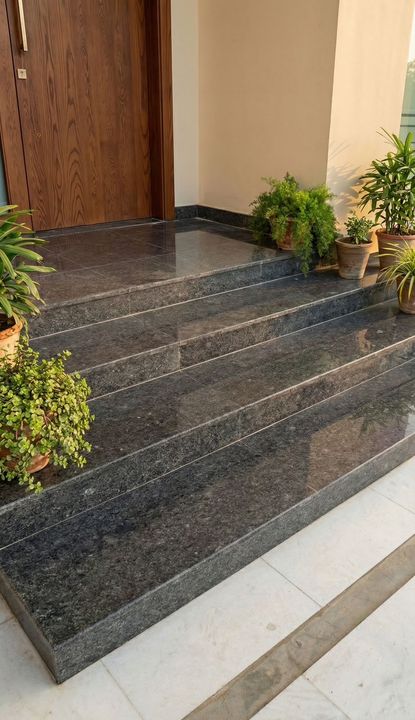 Entrance staircase finished in dark polished granite