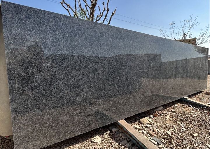 Polished grey speckled granite slab
